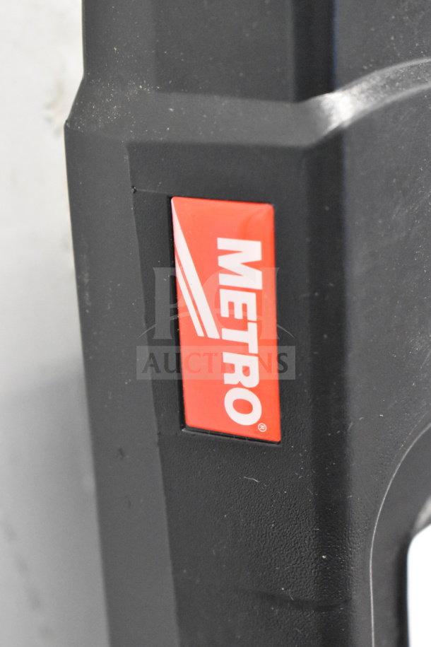 Brand new Metro top shelf for cart, black with red logo. Minor scratches and dents present.