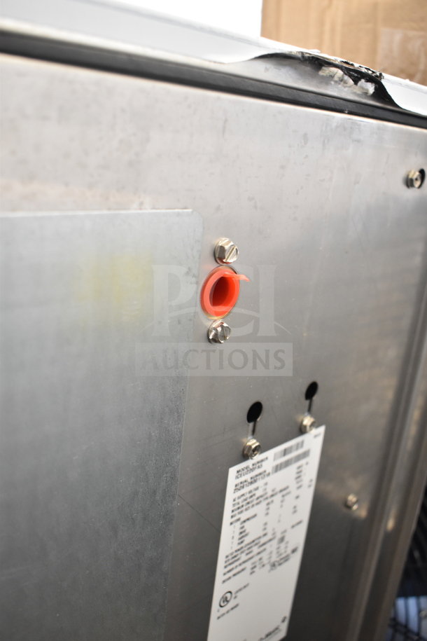 Brand new Ice-O-Matic ICEU220FA5 ice machine, scratch and dent condition, with visible label and minor damage on corner.