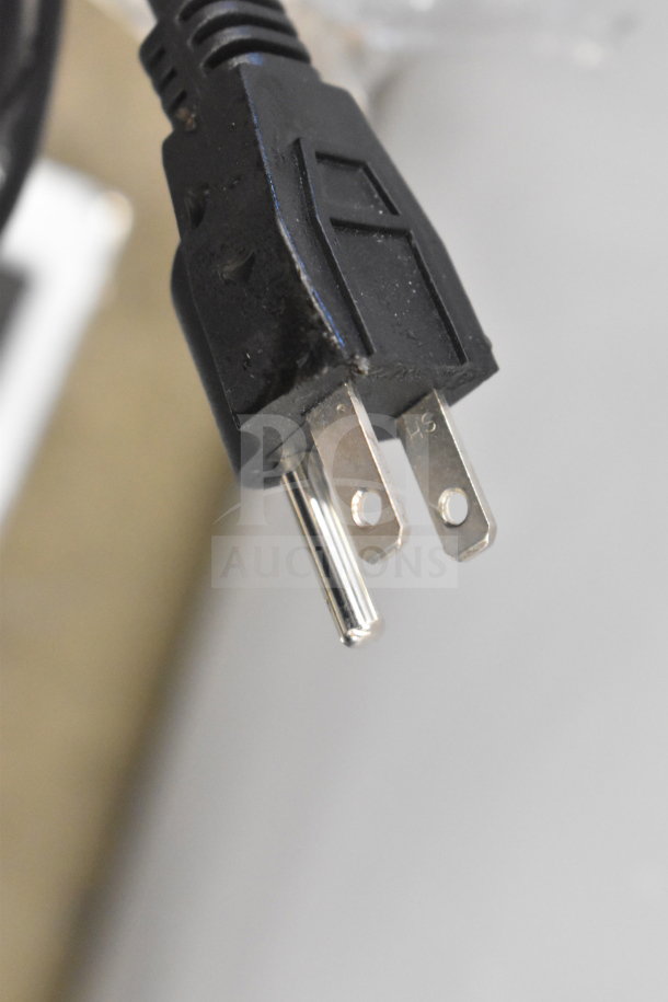 "Power plug of the 2025 Avantco 177STE2S steam table showing standard 120V connection. New condition despite minor blemishes."