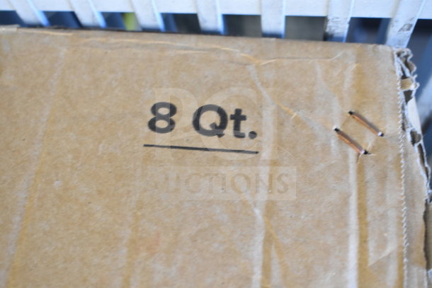 Cardboard box with "8 Qt." marking, indicating capacity for the Choice Deluxe 8 Qt. Rectangular Roll Top Chrome Trim Chafer Cover.