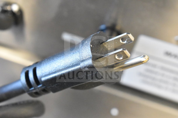 "Globe Chefmate PF10E electric fryer's power plug showing prongs; labeled 'BRAND NEW SCRATCH AND DENT.'"