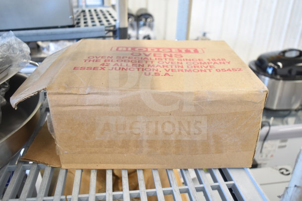 Cardboard box labeled "Blodgett Ovens," slightly dented, contains Perfect Fry 84291 Air Filter Kit, Blodgett 8281 Basket.