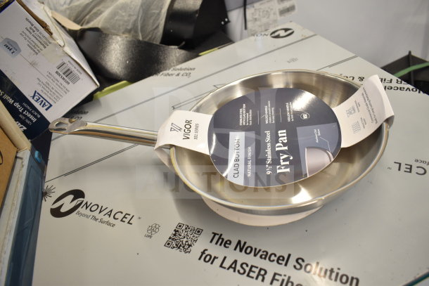 Vigor SS1 Series 9 1/2" stainless steel fry pan with aluminum-clad bottom, new with label showing product details.