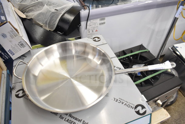 Stainless steel Vigor SS1 Series 16" fry pan with aluminum-clad bottom and helper handle, new condition.
