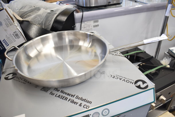 18 new Vigor SS1 Series stainless steel fry pans; includes 9 1/2" and 16" sizes with aluminum-clad bottom, helper handle.