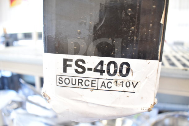 BRAND NEW SCRATCH AND DENT FS-400 Impulse Sealer, 110V, 1 Phase, visible label indicates model and voltage.