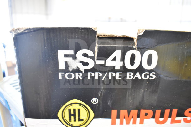 Box of FS-400 Impulse Sealer for PP/PE bags. Visible scratch and dent on packaging. 110 Volts, 1 Phase.