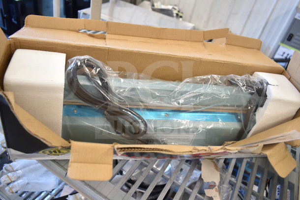 BRAND NEW FS-400 Impulse Sealer in damaged box, 110V, 1 Phase, with visible cord, padding, and protective wrap.