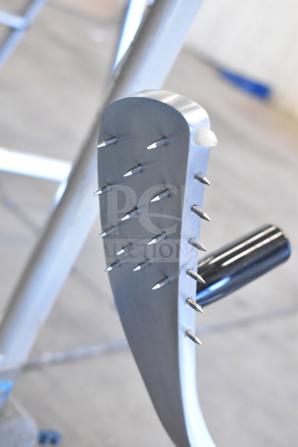 Avantco 177SL312 meat slicer detail showing durable metal construction with sharpening blades, designed for commercial use.
