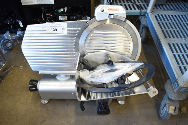 Brand new Avantco 177SL312 meat slicer, 12" manual gravity feed, sharpening blade, slight scratch, commercial use.