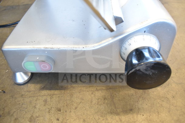 Avantco 177SL312 commercial meat slicer showing control knob and power switch, scratch and dent condition.