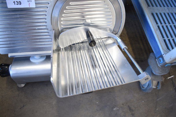 Avantco 177SL312 commercial meat slicer, 12" manual, gravity feed, with sharpening blade; scratch and dent condition.