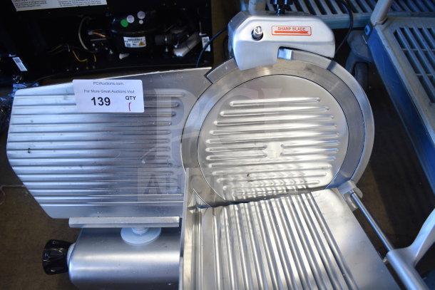 Brand new Avantco 177SL312 meat slicer, 12" manual gravity feed with sharpening blade. Scratch and dent condition.