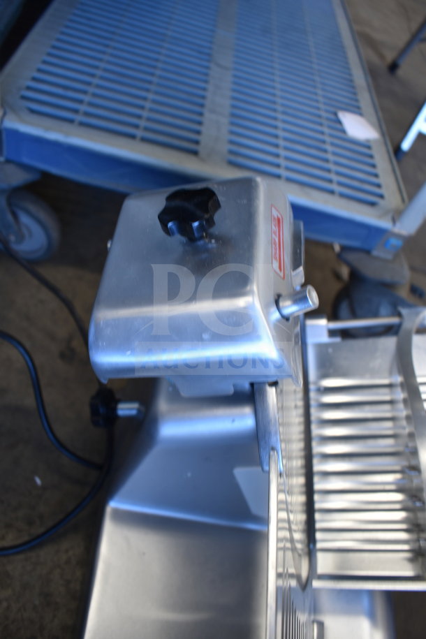 Avantco 177SL312 meat slicer, 12" blade, manual, gravity feed, sharpening blade, new with minor dents, 110-120V, 1 phase.