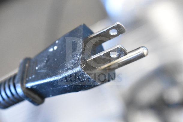 Close-up of a power plug from a brand new Avantco 177SL312 commercial meat slicer. Plug is 110-120V, 1 Phase.