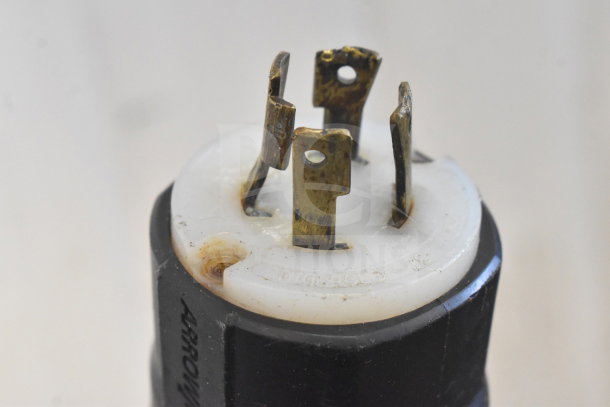 Close-up of a metal prong plug from the Biro EMG-32 meat grinder mixer, showing wear.