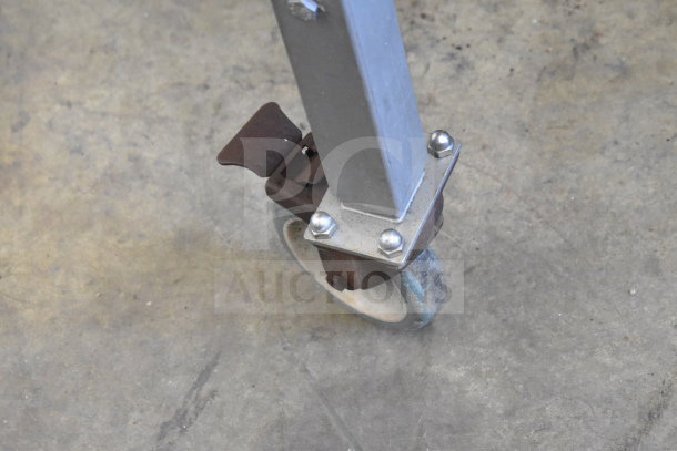 Biro EMG-32 meat grinder mixer caster on commercial wheel. Visible wear and metal components secured with bolts.