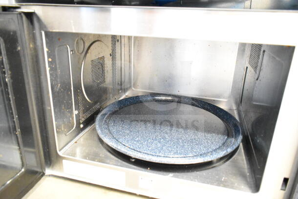 Wolf MWC24 Countertop Microwave Oven, showing interior with glass turntable. Model: MWC24. 120 Volts, 1 Phase. Used condition.
