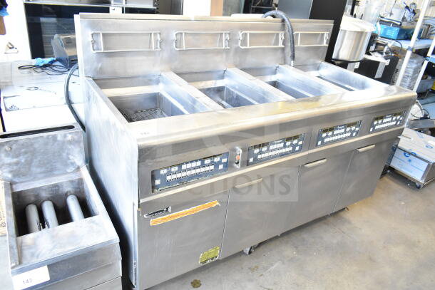 Frymaster BIGLA430CSD 3-bay commercial fryer on casters, natural gas, stainless steel, control panels visible, good condition.