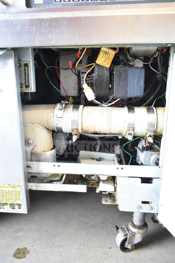 Frymaster BIGLA430CSD 3-bay fryer, natural gas powered, on casters, showing interior components and wiring, used condition.