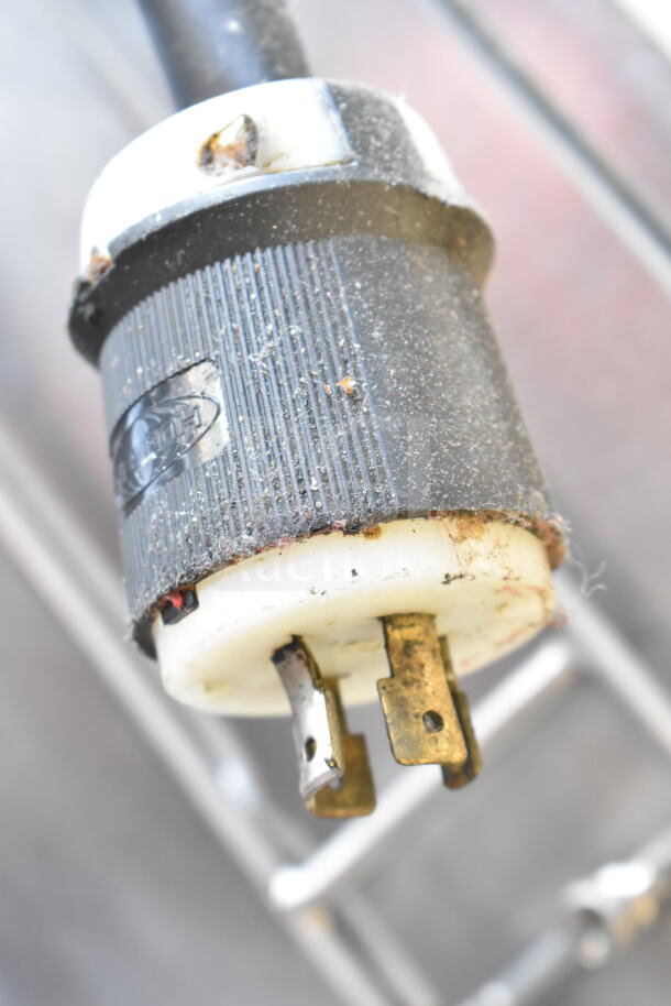 Close-up view of a worn power plug for a Frymaster BIGLA430CSD commercial fryer, showing dust and wear on connectors.