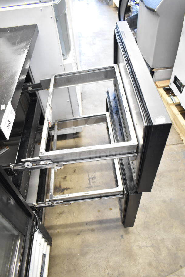 2018 True TUC-27D-2-LP-HC commercial undercounter cooler, 2 drawers open, steel frame visible, for 115 volts, 1 phase.
