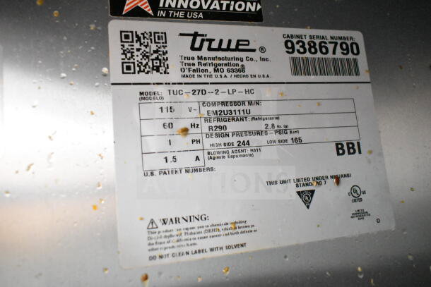 Label on 2018 True TUC-27D-2-LP-HC commercial cooler showing model, voltage, refrigerant type, and certifications.