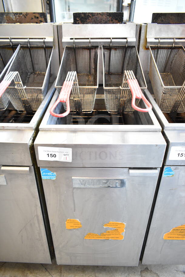 Vulcan commercial gas deep fryer with two baskets, stainless steel, Energy Star label, visible wear, model unspecified.
