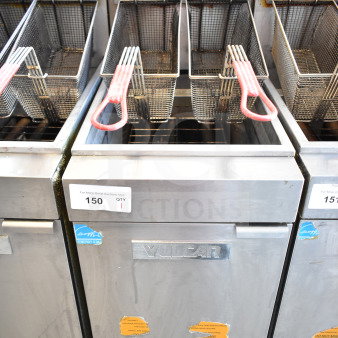 Vulcan commercial gas deep fryer with two baskets, stainless steel, Energy Star label, visible wear, model unspecified.