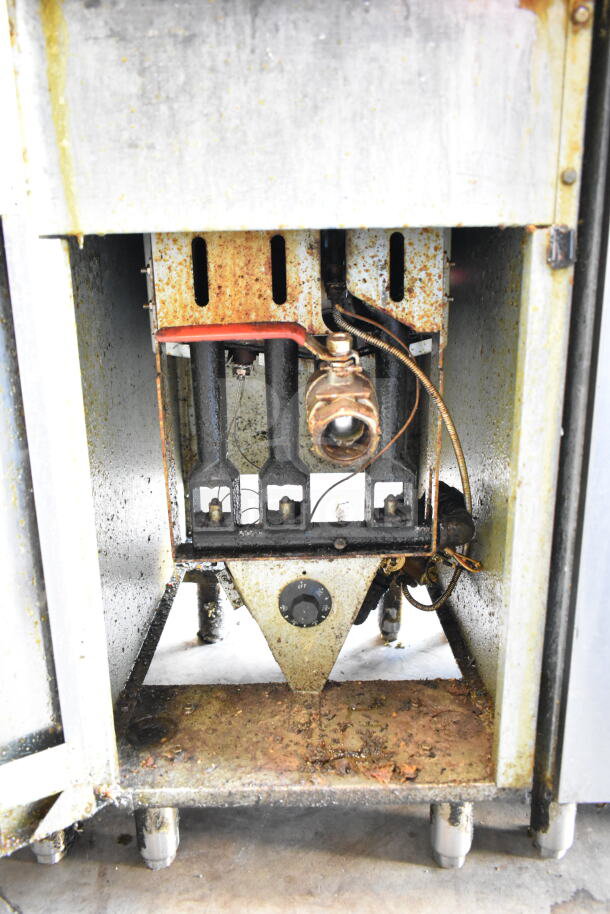Vulcan commercial gas deep fat fryer with two fry baskets, showing inner components and control knob; moderate wear visible.