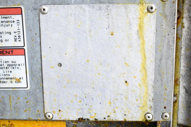 Vulcan commercial gas fryer, floor style, with 2 baskets. Used condition, visible grime and residue, safety label attached.
