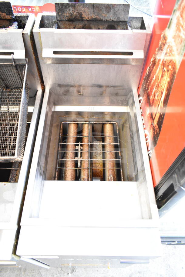 Vulcan commercial gas deep fat fryer with 2 fry baskets. Stainless steel, used condition, visible signs of wear.