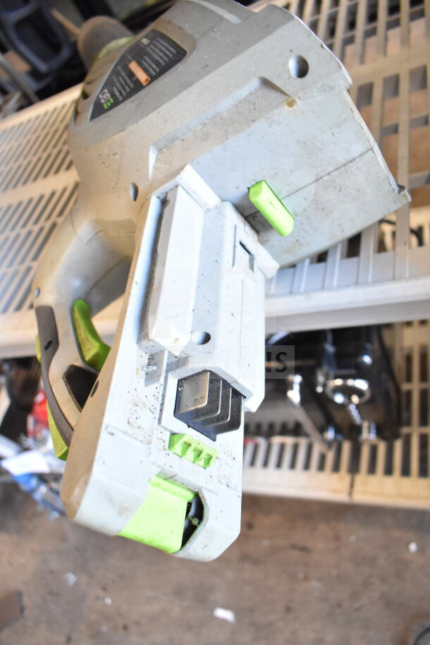 EGo Power+ battery powered blower in used condition, featuring ergonomic grip and battery compartment. Visible scuffs and dirt.