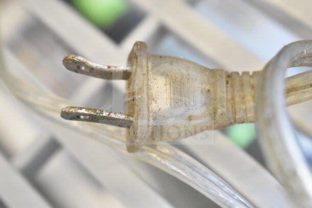 Close-up of a power plug for various 120-volt bug zappers, showing signs of wear. Five zappers included per bid.