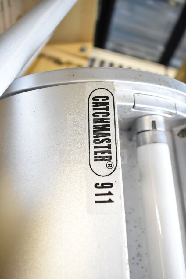 Five Catchmaster bug zappers, 120 volts, 1 phase, labeled "911," slightly worn condition.