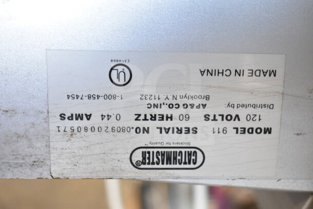 Label on bug zapper reading "Catchmaster, Model 911, 120 Volts, 60 Hertz, 0.44 Amps, Serial No. 080920080671, Made in China."