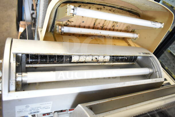 Five various bug zappers, 120 volts, 1 phase, used condition, visible debris and labels, enhances insect control.