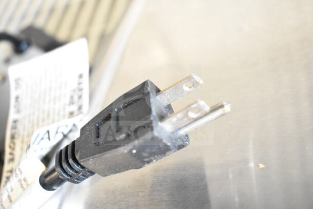Close-up of a plug for 5 various bug zappers. 120 volts, 1 phase. Auction lot indicates five times your bid.