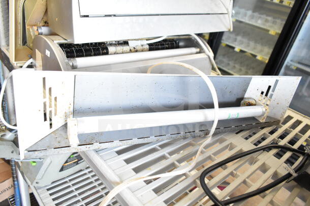 Five various bug zappers, 120 volts, 1 phase, shown with cords. Slight wear visible. Auction offers 5 times your bid.