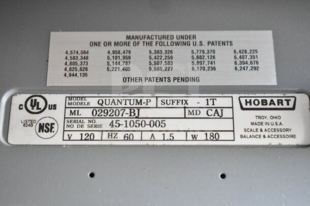 Hobart Quantum-P-1T scale label showing model, serial number, voltage, and patent details. No power cord included.