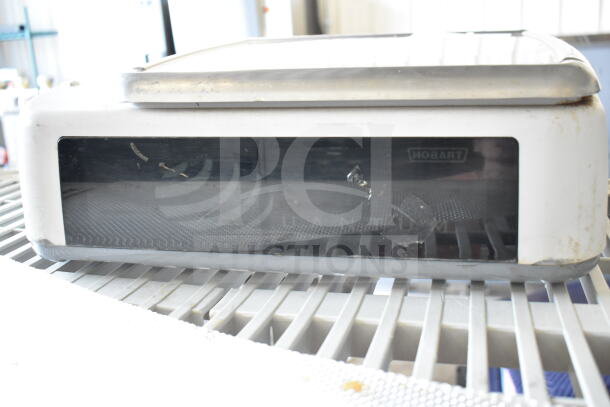 Hobart Quantum-1 commercial food portioning scale, 120 volts, 1 phase, tested and working, slight wear on exterior.