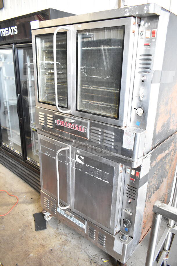 Blodgett commercial full-size convection ovens; one with view-through doors, one with solid doors; used condition.
