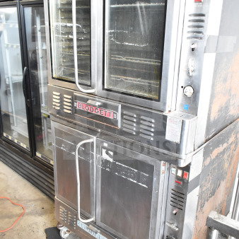Blodgett commercial full-size convection ovens; one with view-through doors, one with solid doors; used condition.