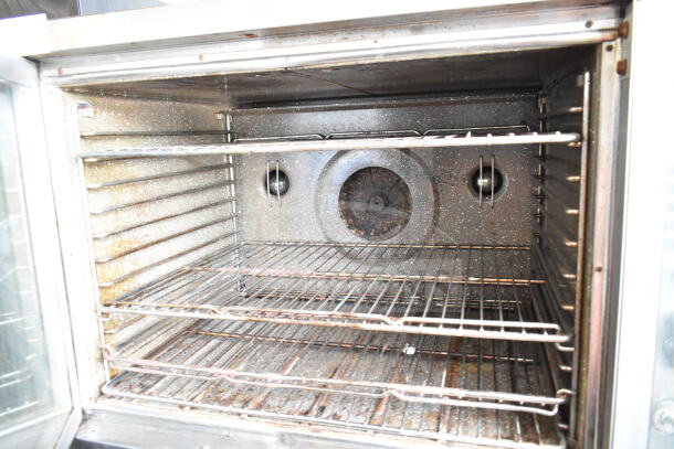 Blodgett commercial gas convection oven interior with racks, some wear visible. Includes view-through and solid door models.