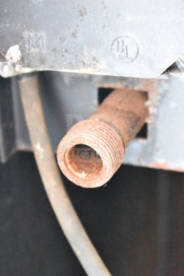 Rusty gas connection on Blodgett commercial gas convection oven, UL and M markings visible on metal plate above.