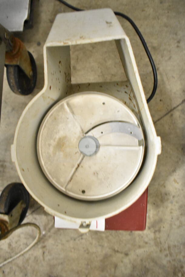 "Robot Coupe R2N commercial countertop food processor, visible wear, 120 volts, 1 phase, used condition, top view display."
