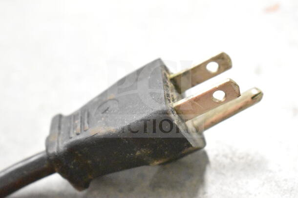 Power plug of Robot Coupe R2N food processor, 120V, 1 phase, close-up view. Plug shows signs of use.
