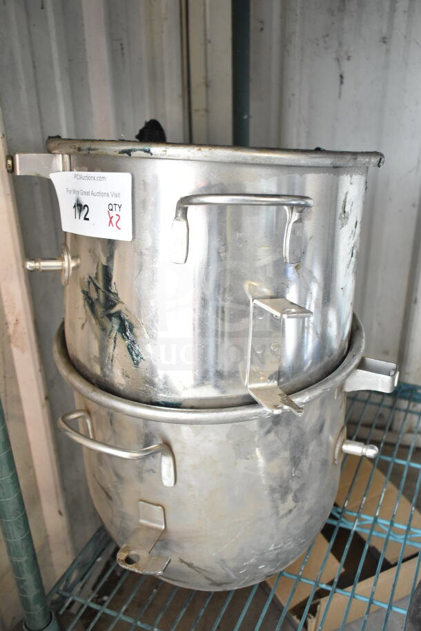 Two stainless steel mixing bowls with side handles, stacked. Quantity label reads "QTY x2." Visible wear marks suggest industrial use.