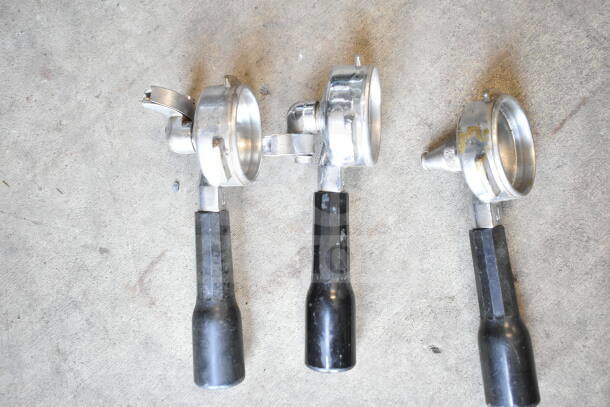 Three metal portafilters with black handles, used condition. Part of a lot including bowls and a poly bin.