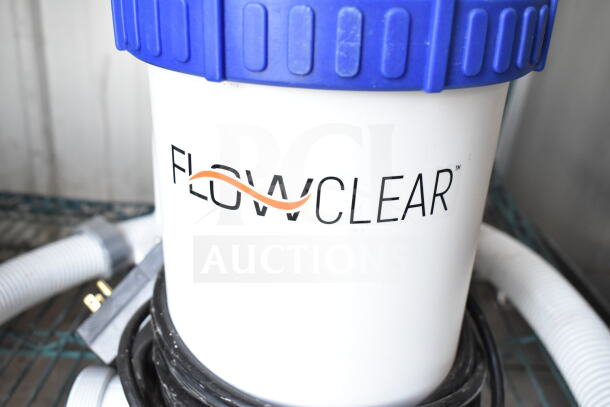 FlowClear 90403E Filter Pump, 110-120V, 1 Phase, featuring blue cap and logo. Includes power cord and hoses.